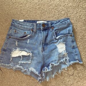 medium washed ripped women’s jeans shorts